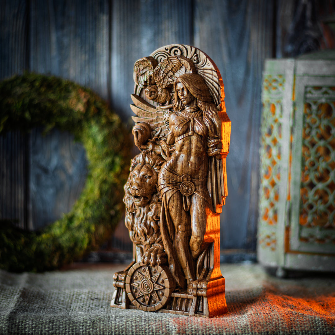 Angled perspective of Inanna statue in oak wood – powerful Mesopotamian goddess with wings, lion, and star wheel