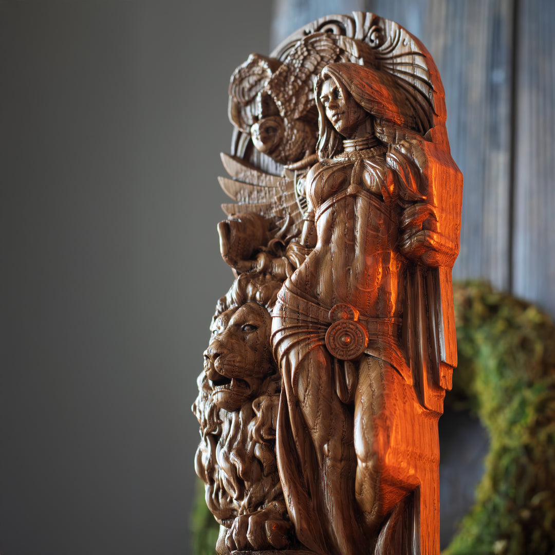 Side detail of oak Ishtar sculpture showing muscle form, lion protector, and divine Mesopotamian motifs