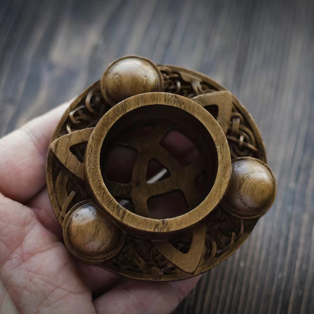 Candle holder with Norse ornaments from oak "Triquetra"